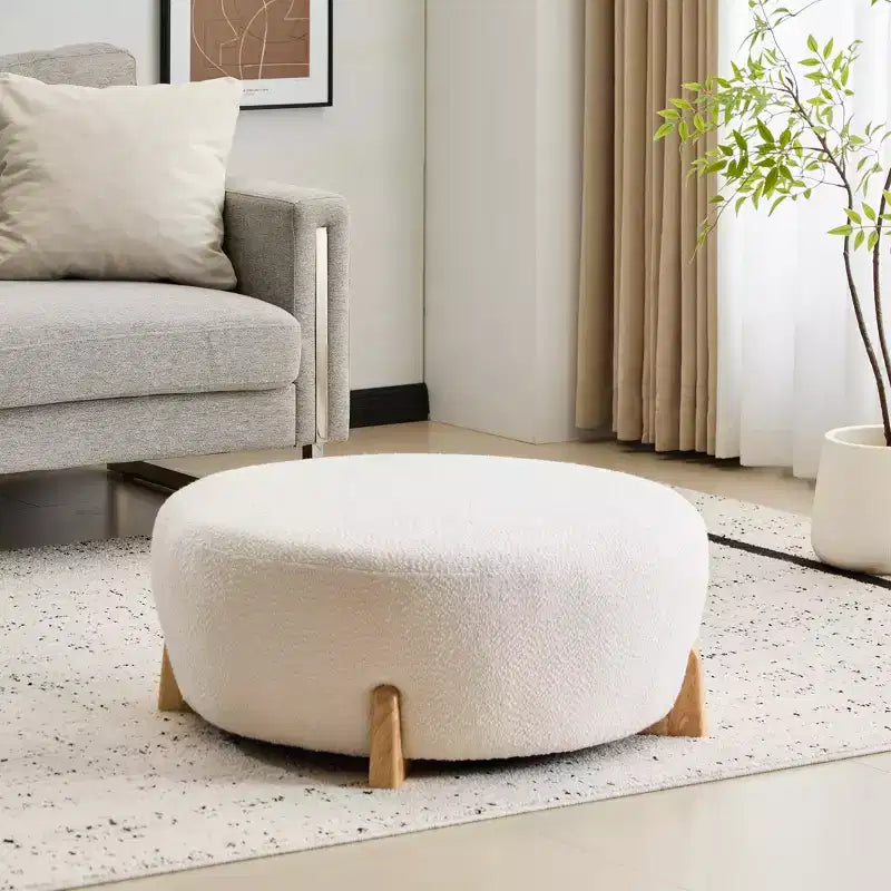 Pouf rotondo moderno in tessuto bouclé